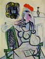 Mujer sentada con un sombrero rojo cubista de 1934 Pablo Picasso